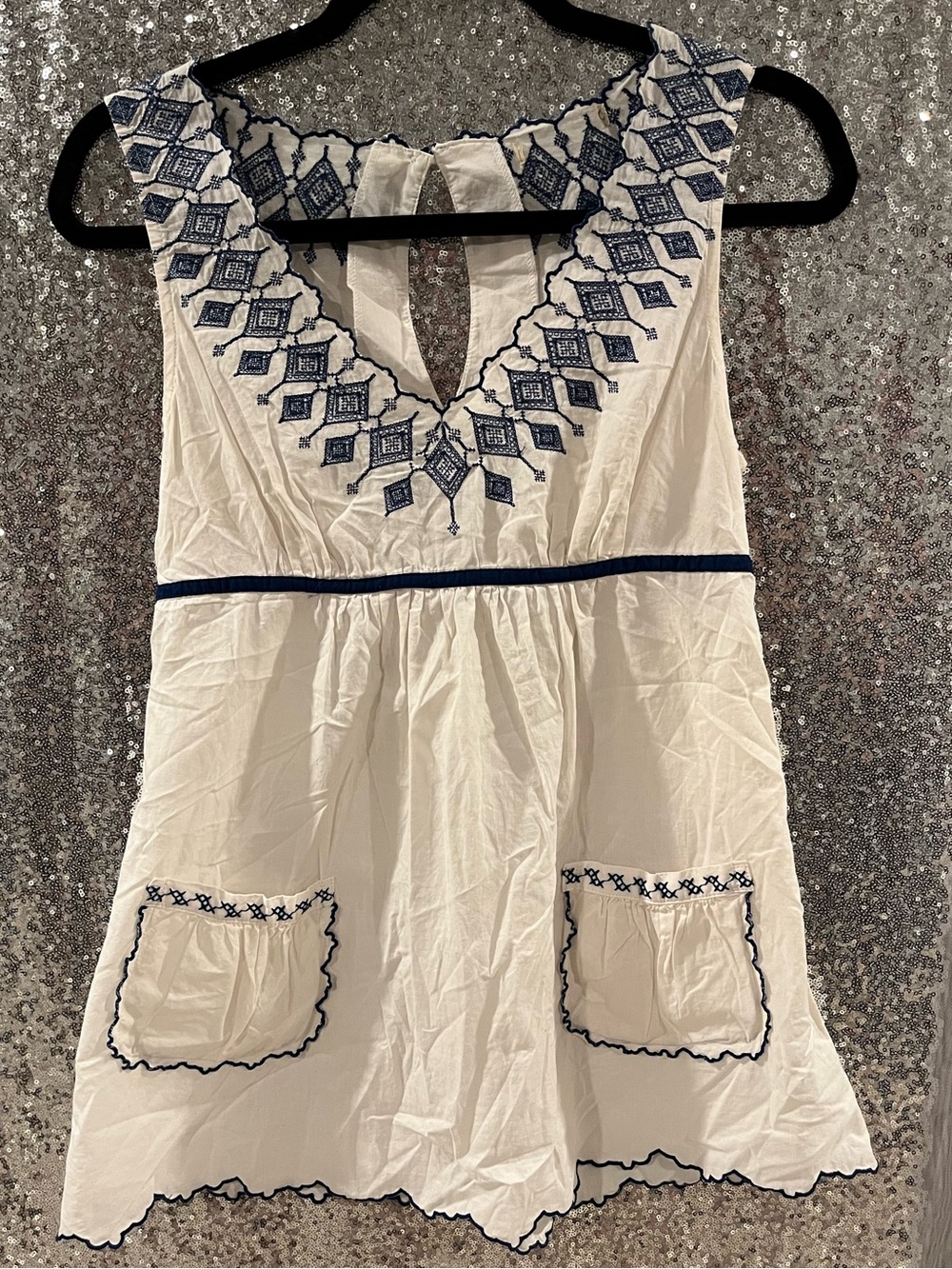 White Sleeveless Embroidered V-Neck Top with Navy Trim
